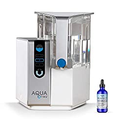We Paired AQUA TRU Reverse Osmosis Water Filtration System & PERFECT MINERALS Drops Which Raise the Body's PH to Alkaline: Helps prevent an "Acidic" environment a higher PH reduces the chances of dangerous cells being able to thrive in the human body.
CERTIFIED to NSF Standards by IAMPO to remove 82 CONTAMINANTS - that's 15X more contaminants than the leading pitcher filters. AquaTru removes such poisons as Lead 99.1%, Hexavalent Chromium 97.2%, Copper 95.2%, Fluoride 93.5%, Radium 96.4%, and Chlorine 96.6% (to name a few). In fact, it's designed to remove 1000's of pollutants that could be lurking in your tap water. Taste the Difference!
NO PLUMBING OR INSTALLATION required - plug in and start purifying. AquaTru’s Patented RO countertop system COSTS CONSIDERABLY LESS than fully installed, under-the-counter RO systems, while at the same time, delivering often Cleaner, Purer, and Better Tasting Water. Why waste money & crowd landfills with bottled water (93% recently found in study to contain micro-plastics). Invest in your health, the planet & long-term savings with a AquaTru's patented Ultra Reverse Osmosis system.
1 FULL SET OF QUICK CHANGING TWIST-AND-SEAL FILTERS come included with your first AQUA TRU system, and last from 6 months to 2 years. SLEEK COMPACT DESIGN - 14'' Tall x 14'' Deep x 12'' Wide - Purifies 1 gallon of tap water into better-than-bottled-quality water in just 12-15 minutes.
100% SATISFACTION GUARANTEED - 30-Day Money Back Guarantee. If for any reason, you are not happy, you can get a refund. No questions asked. - Many popular water filters and water purifier systems claim to turn dirty water ‘pure’, but unfortunately, leave serious chemicals and contaminants behind. With AQUA TRU, you can feel confident that you are getting ULTRA-PURE WATER from a reverse osmosis system that has undergone extensive analysis, tests and certifications.
